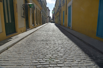 Fototapeta na wymiar Old cobblestone pavement close up.