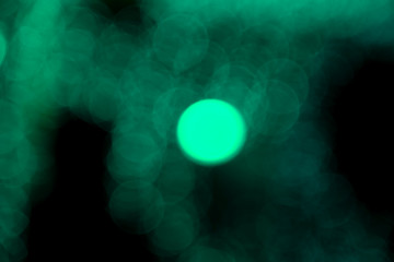 Defocused of blurred aqua menthe bokeh circle light from lighting bulb in the night for abstract background texture patterns