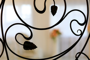 Old forged lattice with round rods, rivets and curly elements. - Image