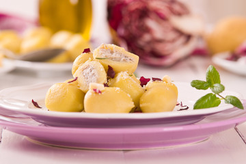 Potato gnocchi stuffed with radicchio and ricotta.