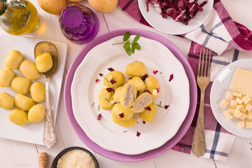 Potato gnocchi stuffed with radicchio and ricotta.