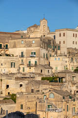 Obraz premium View of the Sassi di Matera a historic district in the city of Matera, well-known for their ancient cave dwellings. Basilicata. Italy