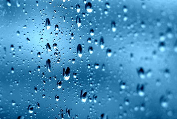 Raindrops on the window. Close-up of water on the glass. After the rain.