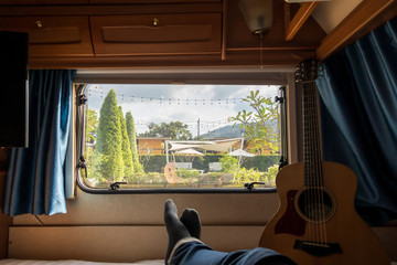 relaxing in a beautiful campervan while travelling with lover feel so good and happy 