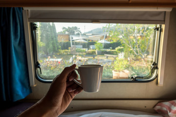 relaxing in a beautiful campervan while travelling with lover feel so good and happy 