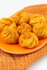 Fried Momos is a Traditional Dumpling Food From Nepal Served with Schezwan Sauce & Cream