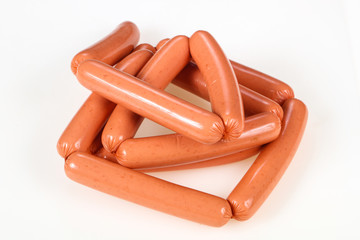 Tasty meat sausages over white background