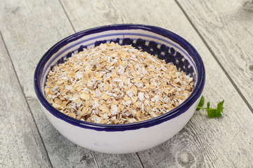 Raw oats in the bowl