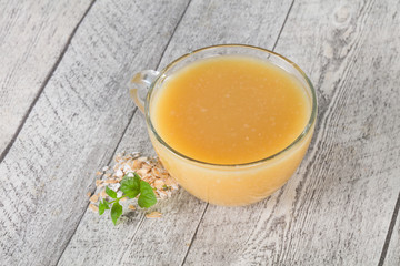 Dietary vegetarian oats milk over wooden