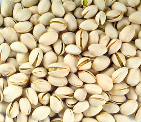 nuts or pistachios nuts on a background new.