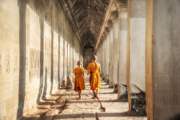 View of the two neophytes walking inside an Angkor Wat, Siem Reap, Cambodia.