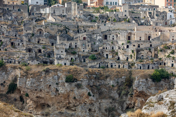 Fototapeta na wymiar Panoramic view of Sassi di Matera a historic district in the city of Matera, well-known for their ancient cave dwellings from the Belvedere di Murgia Timone, Basilicata, Italy