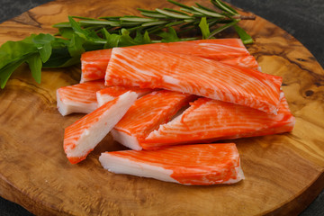 Crab stick surimi over board