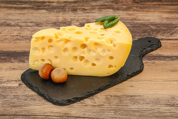 Maasdam cheese - yellow triangle with holes
