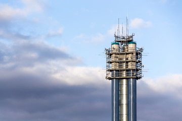 Water tower with antennas and satellites, telecommunication tower, wireless communication concept, blue sky on a sunny day, Devin, Prague, Czech Republic