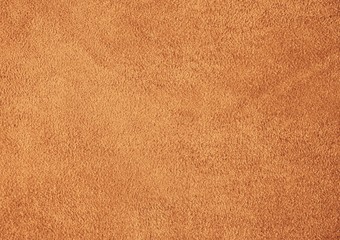 Fototapeta na wymiar Suede leather. Genuine leather material. Brown background. Beige background. Skin testure. Suede.