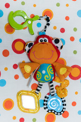 Baby toy monkey for babies with graveling legs.