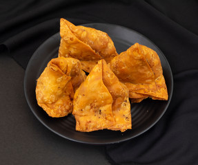 Indian Street Food Samosa or Samosas is a Crispy And Spicy Triangle Shape Snack Which Has Crisp...