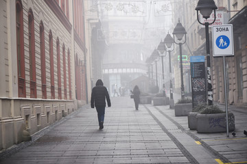 walking into the foggy streets