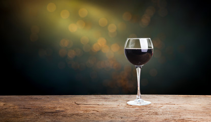 Pouring red wine into glasses in the vineyard, toned