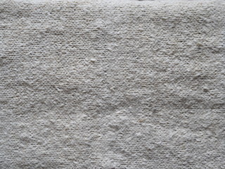 Fototapeta premium Woolen knitwear. A woolen sheepskin belt, knitted from a self-spun sheepskin. Designed to treat the spine and lower back of a person.