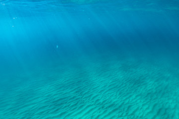 Fototapeta na wymiar Underwater of tropical reef with sea sun rays passing through water.