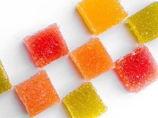 Delicious colorful marmalade isolated on white background