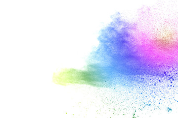 Freeze motion of colorful color powder exploding on white background.  Paint Holi.