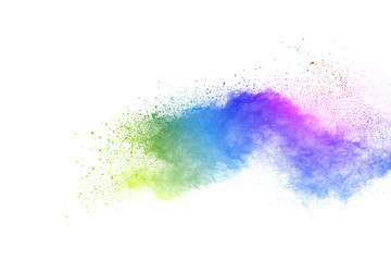 Freeze motion of colorful color powder exploding on white background.  Paint Holi.