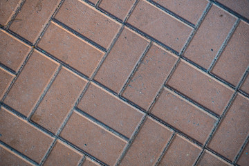 Texture of paving slabs overgrown with grass. Background image of a stratum stone