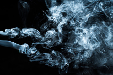 Photo of a wisp of smoke on a dark background