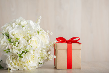 Valentine's Day Concept Gift box and flower on the wooden table