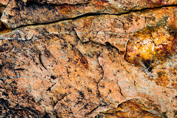 Fototapeta premium The texture of the stone overgrown with moss. Background image of a boulder