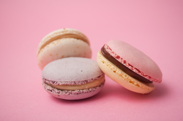 Closeup of french macarons on pink background