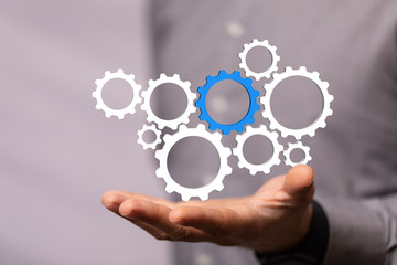 Business, Internet and technology concept. Business select gear icon on virtual screen.