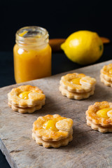 Valentine Holiday food idea concept homemade organic rustic lemon curd shortbread cookies on black background