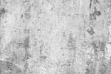 Fototapeta premium Texture of a concrete wall with cracks and scratches which can be used as a background