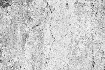 Texture of a concrete wall with cracks and scratches which can be used as a background