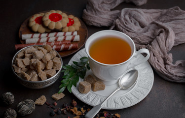 Tea hot drink on old background in composition on the table