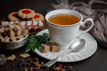 Tea hot drink on old background in composition on the table