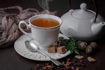 Tea hot drink on old background in composition on the table