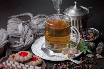 Tea hot drink on old background in composition on the table