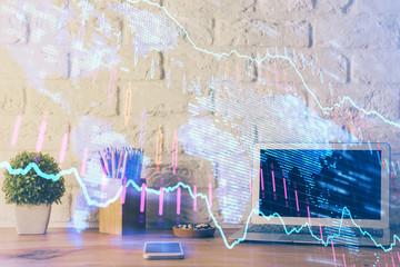 Double exposure of chart and financial info and work space with computer background. Concept of...