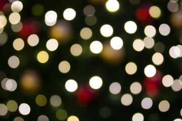 Bokeh christmas tree lights background on a christmas - new years eve season concept