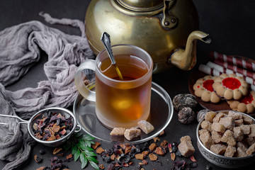Tea hot drink on old background in composition on the table