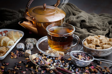 Tea hot drink on old background in composition on the table