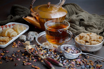 Tea hot drink on old background in composition on the table