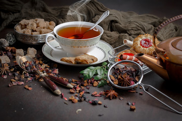 Tea hot drink on old background in composition on the table