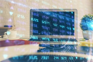 Financial graph colorful drawing and table with computer on background. Double exposure. Concept of international markets.