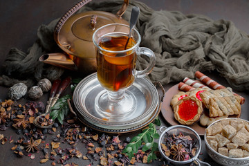 Tea hot drink on old background in composition on the table